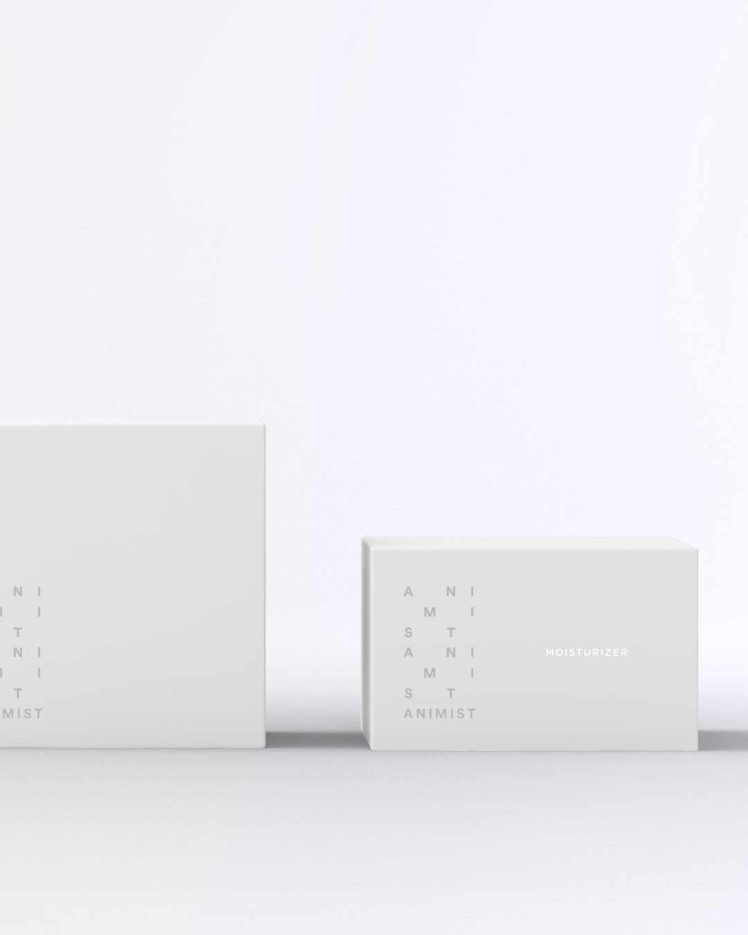 Animist boxes in white with the stacked mark