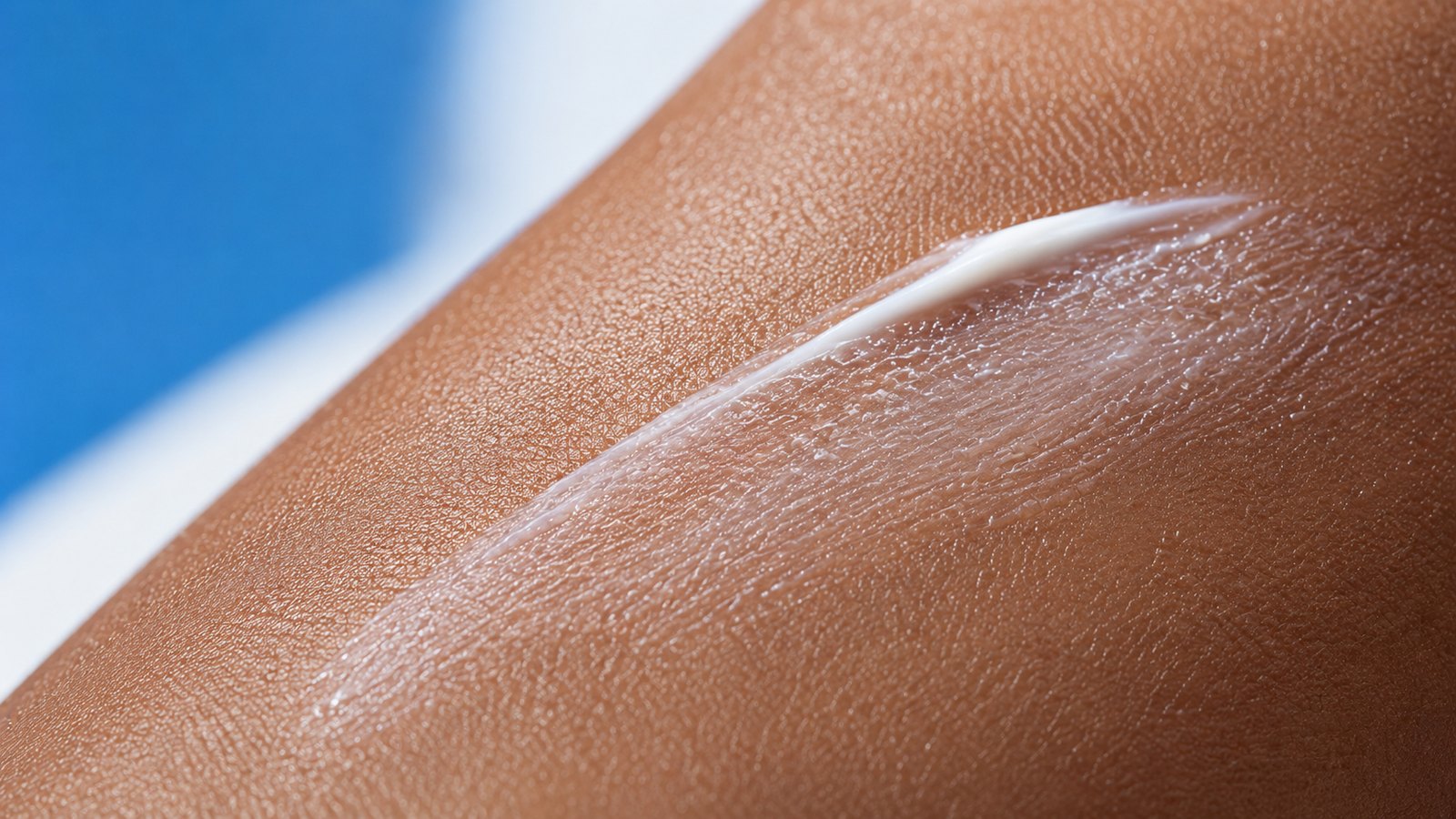 AI concept frame: a sweep of cream on skin, up close