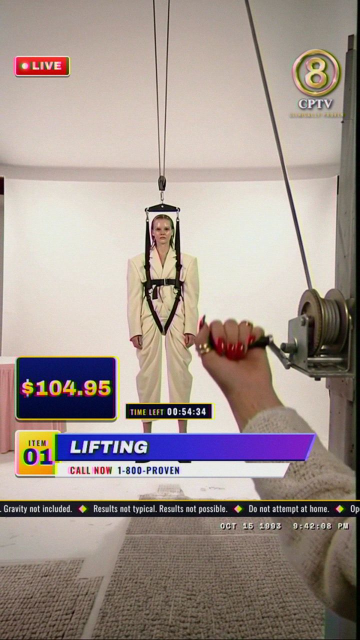 Ep. 01 at 0:01.5: the wide shot, the model in the harness, the item number, lower third and $104.95