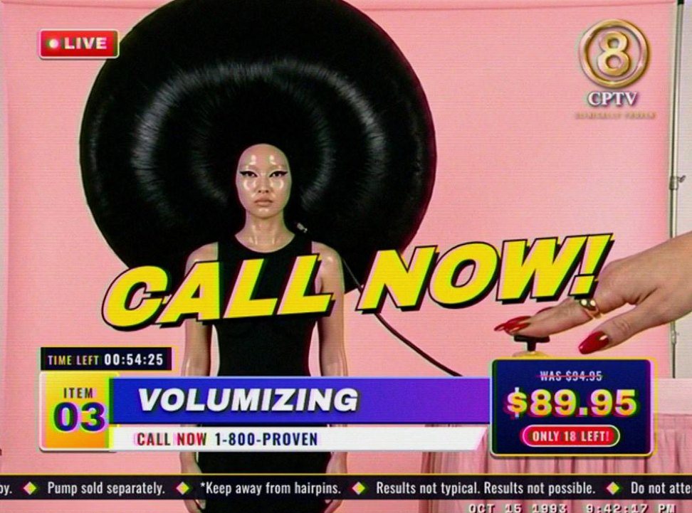Ep. 03, Volumizing in 4:3: a model with a huge round black hairdo, a hand on the foot pump, CALL NOW!