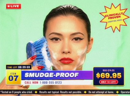 Style frame, item 07, Smudge-Proof: a model scrubbing her face with a blue brush, her red lip untouched