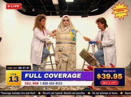 Style frame, item 13, Full Coverage: a model wrapped in drop cloths and tape while assistants paint her