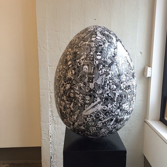 The egg on its plinth by a window