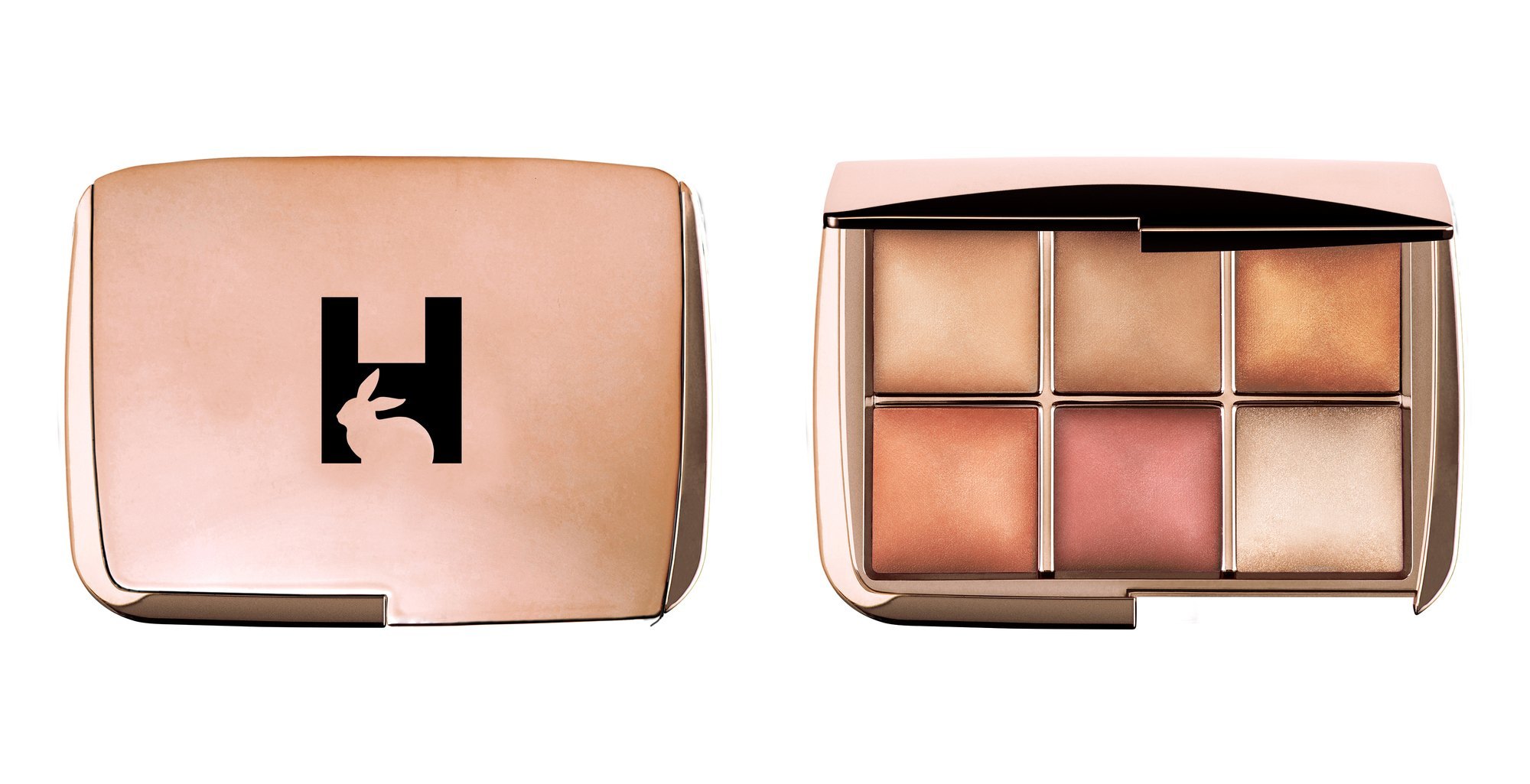A rose gold compact with a black H cut with a rabbit silhouette, beside the open palette