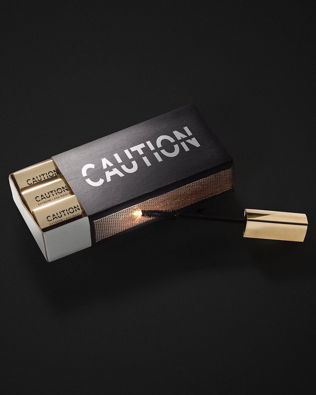 Instagram post: CAUTION mascaras packed like matches in a black matchbox, one wand lit