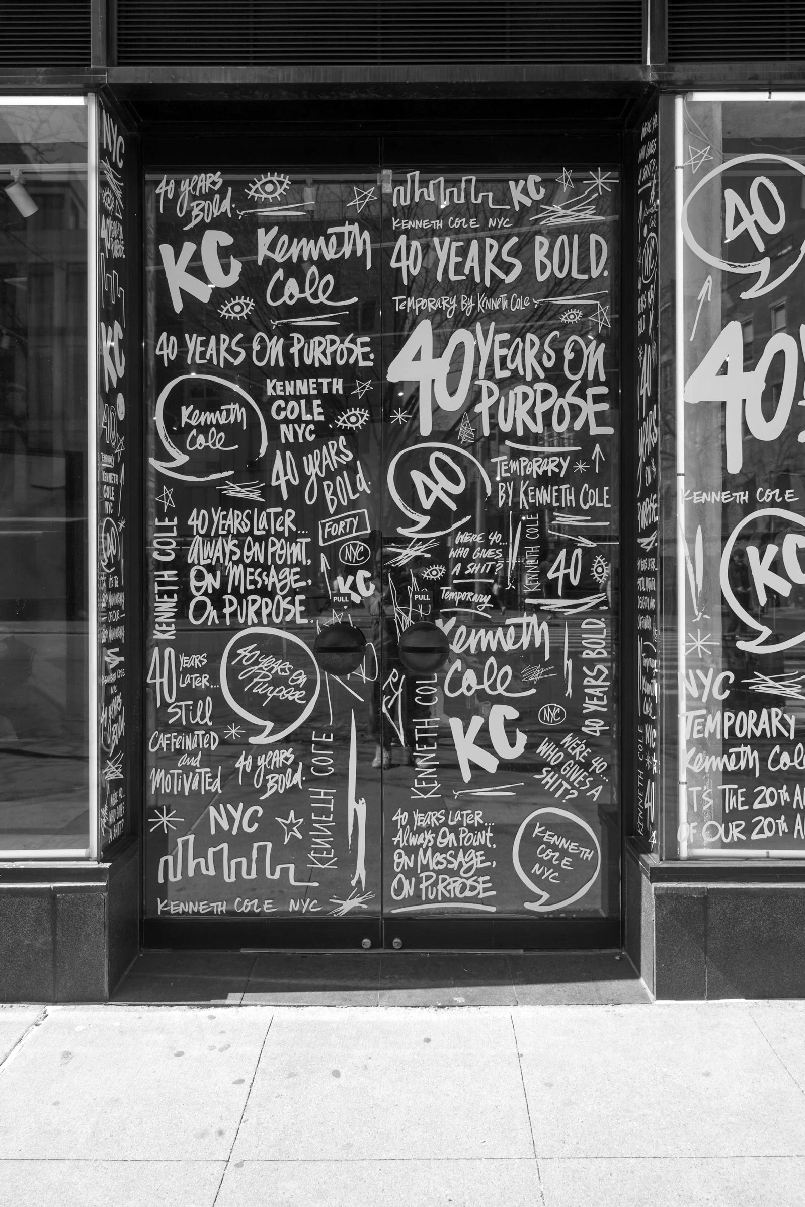 A Kenneth Cole window covered in hand-drawn 40 Years Bold lettering