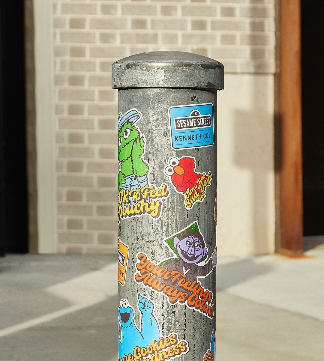 The character stickers wrapped around a street bollard
