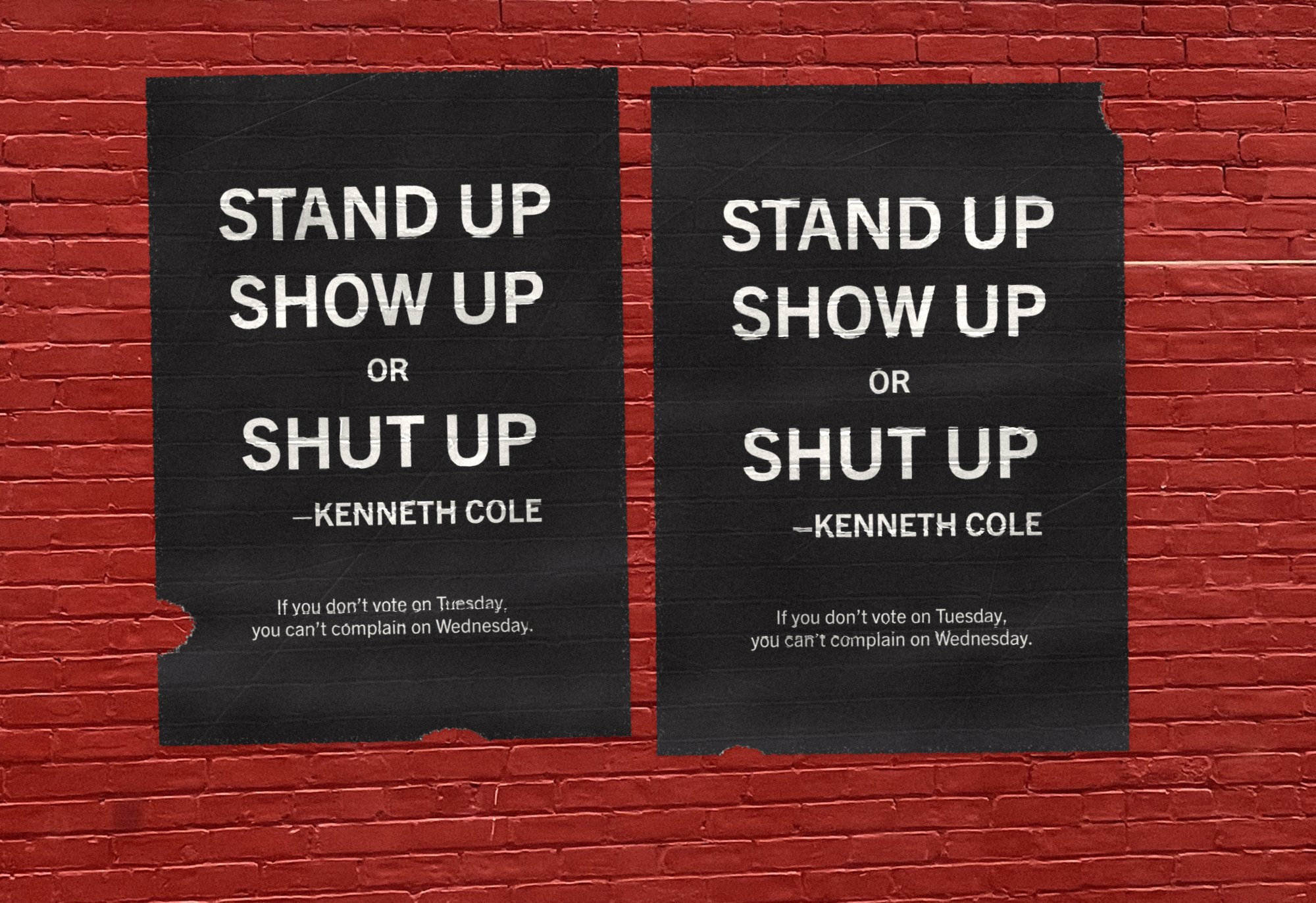 Two black Stand up, show up or shut up posters wheatpasted side by side on a red brick wall