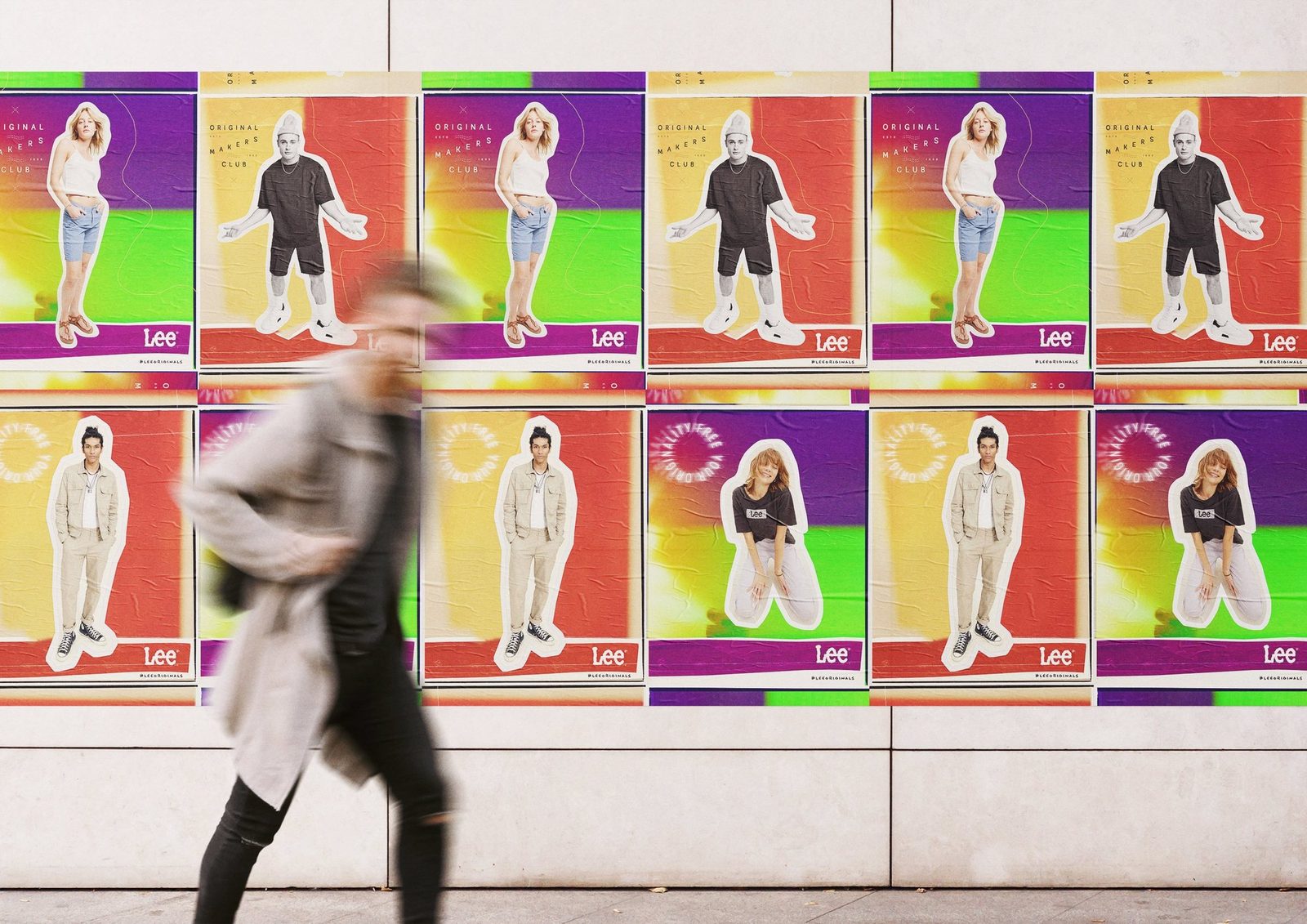 Original Makers Club posters on a city wall