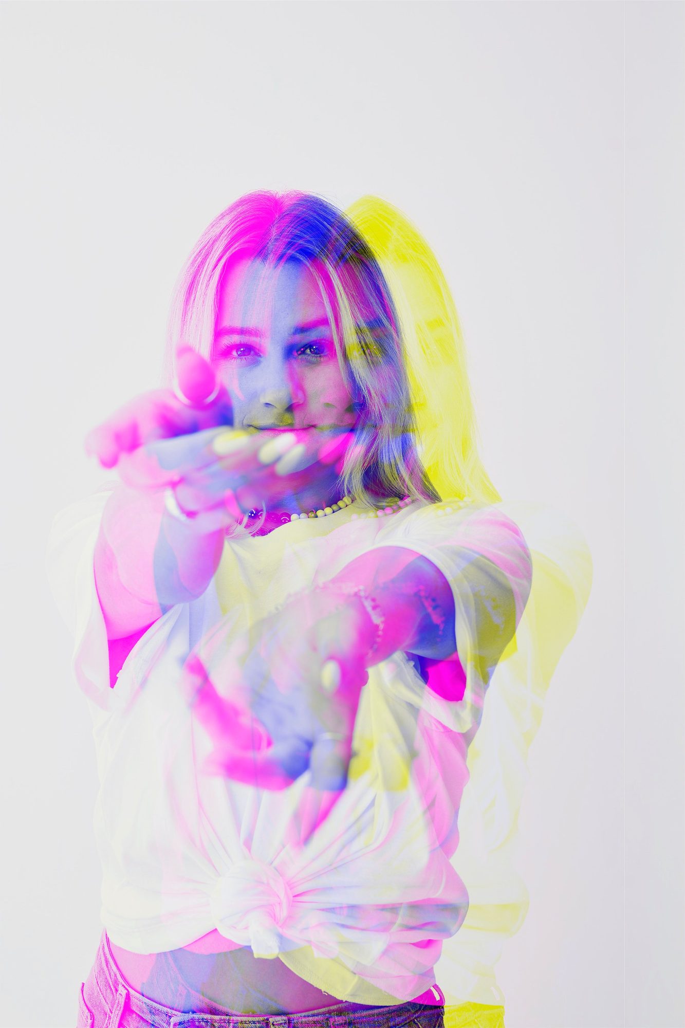 Portrait blowing a kiss toward camera, chromatic
