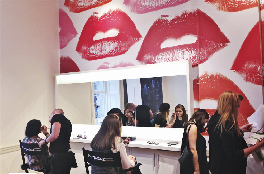 The S/S14 lounge at Somerset House: walls of pop lips, M·A·C artists at the mirrors