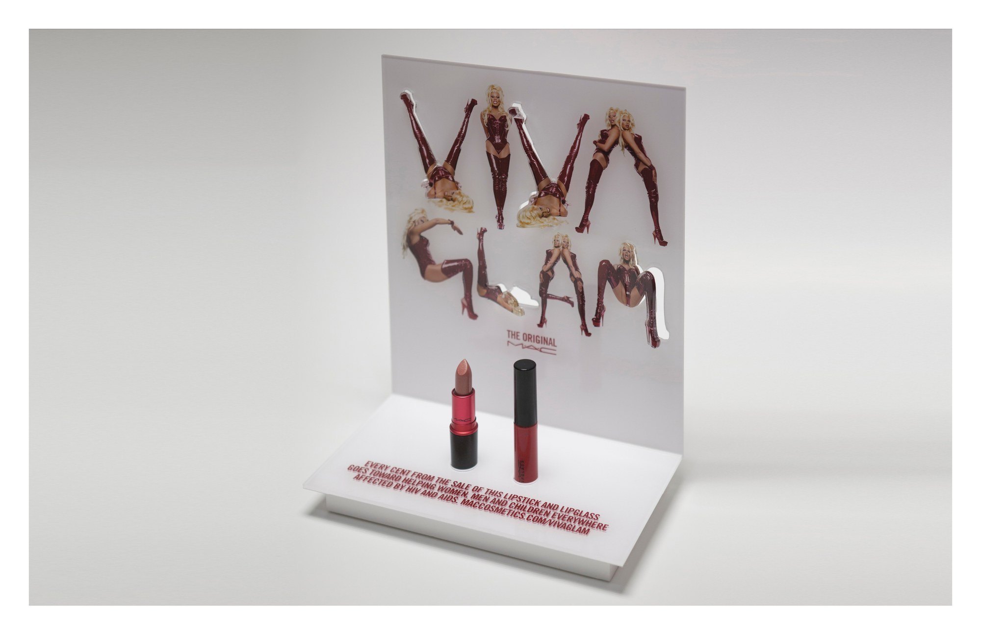 Viva Glam counter display: VIVA GLAM spelled out in cut-out figures above a lipstick and a lipglass