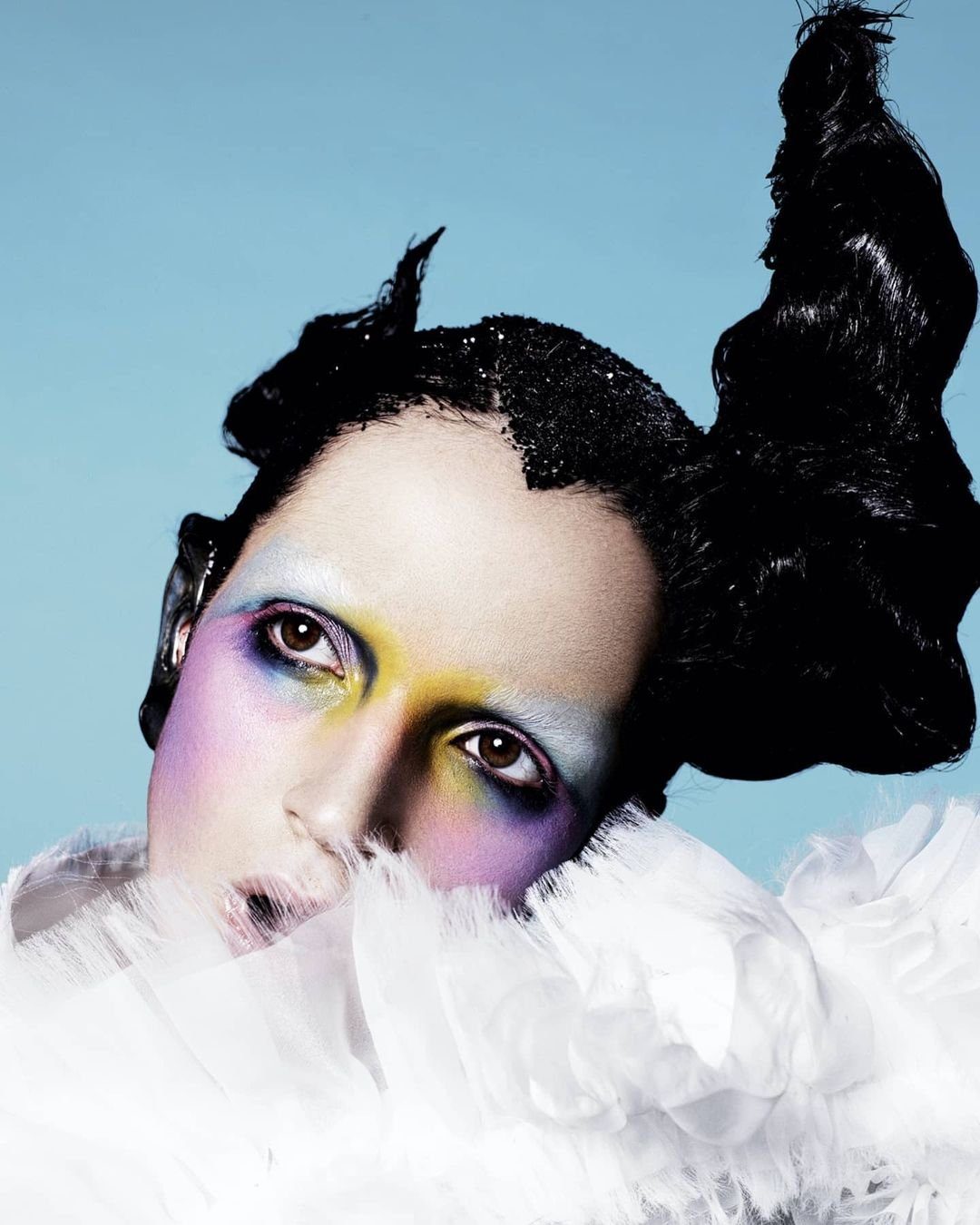 Campaign portrait in white feathers