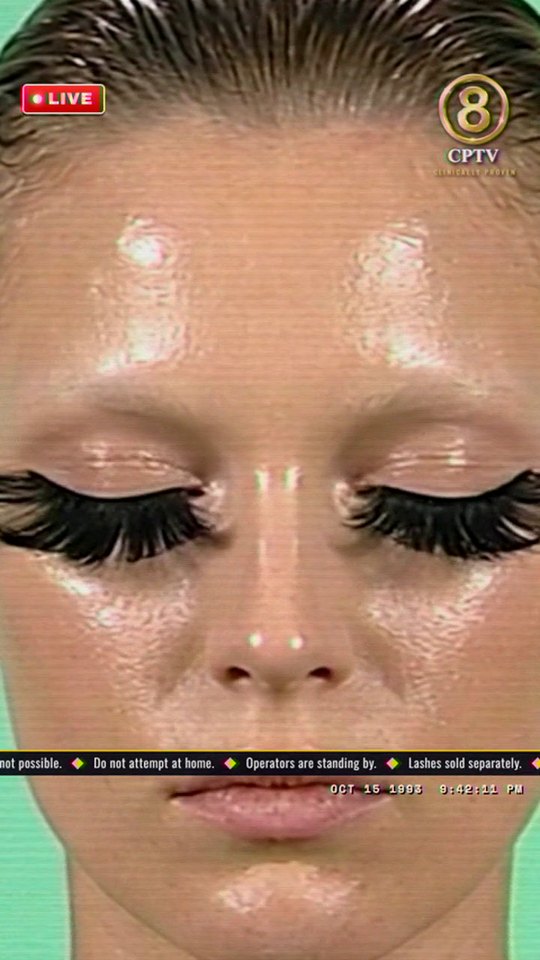 The close up: the model’s eyes closed, lashes stretched out to both sides of the frame
