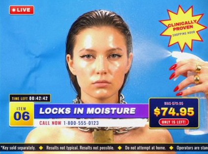Style frame, item 06, Locks in Moisture: a model with a chain and padlock around her neck while a hand sprays her with water