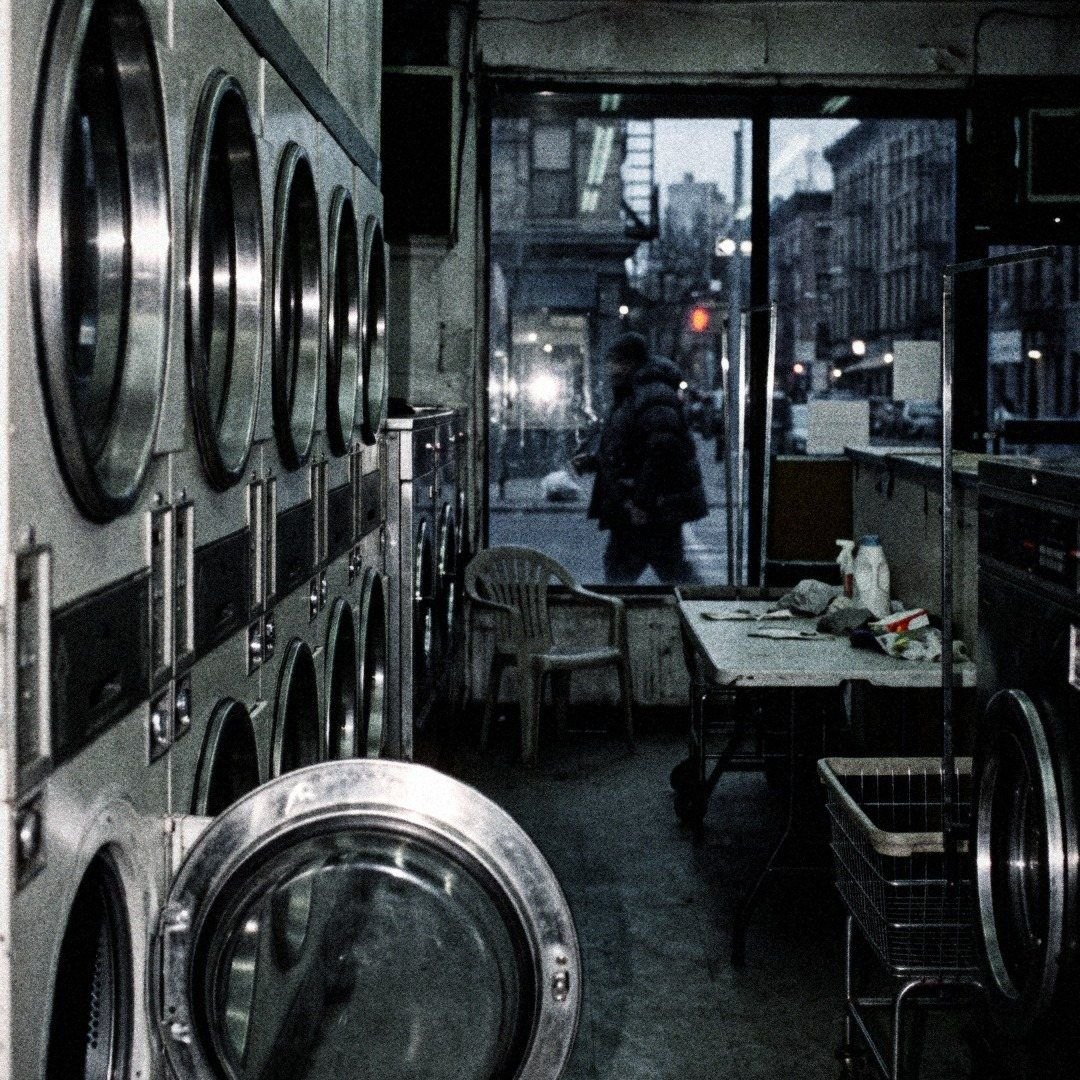 A laundromat, the open door of a machine
