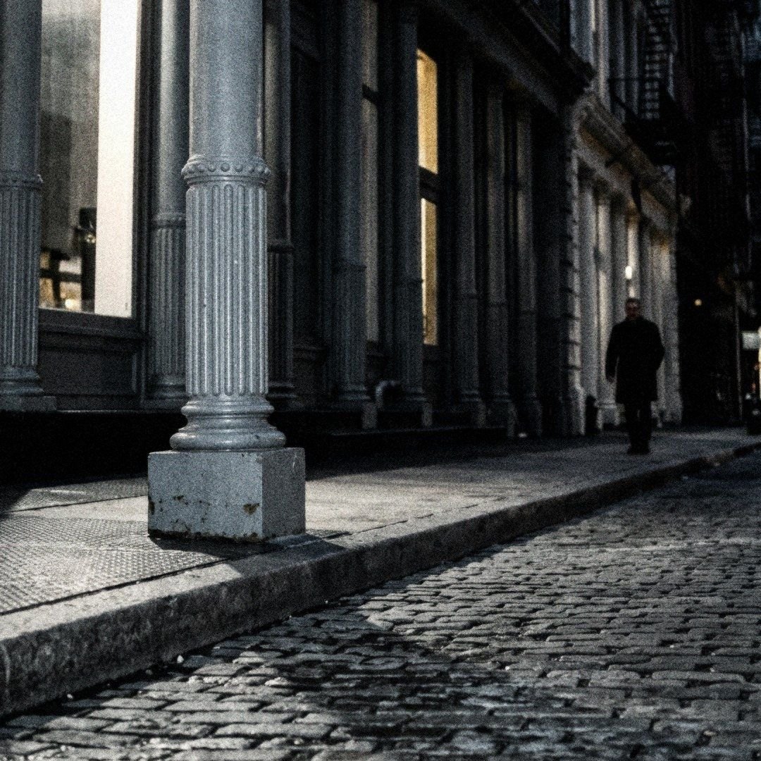 SoHo cast iron columns on wet cobblestones