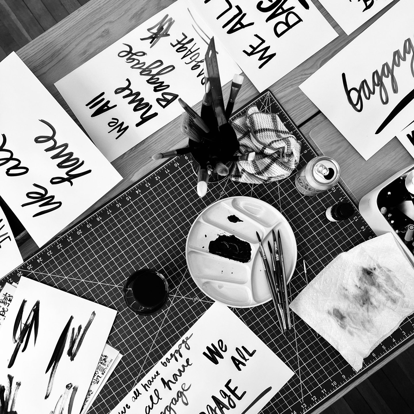 Hand-lettered cards drying on the cutting mat