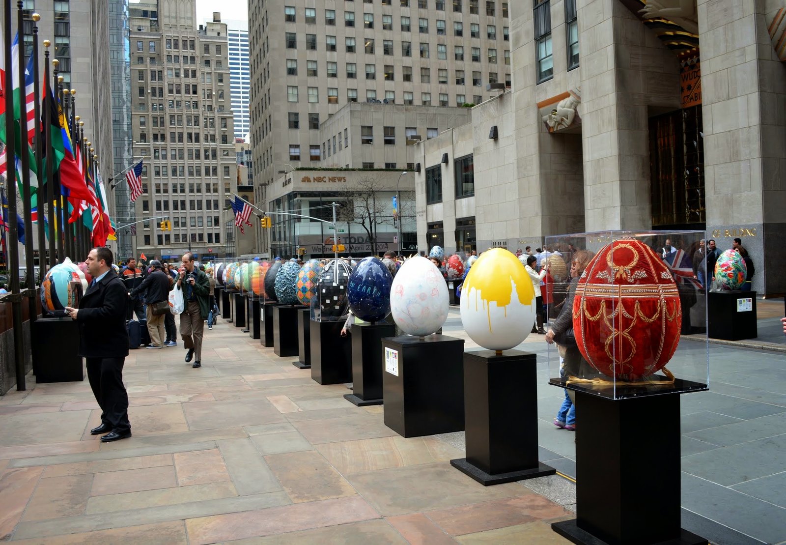 Fabergé eggs on black plinths lined up on the Rockefeller Center plaza