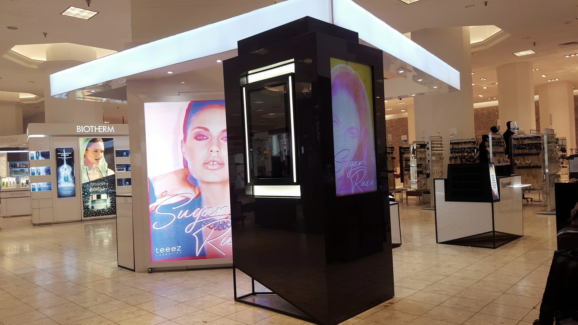 The Sugar Rush lightbox and screen tower at a Teeez kiosk