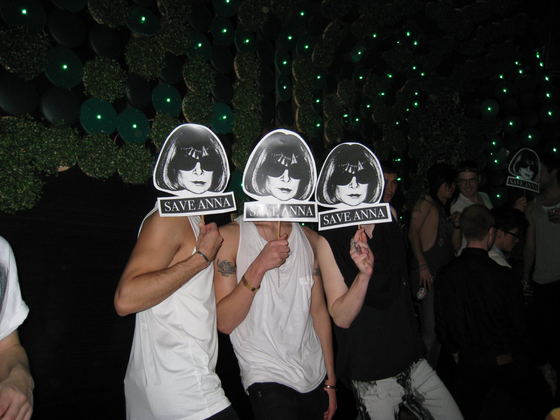 Three Save Anna masks raised on the dance floor