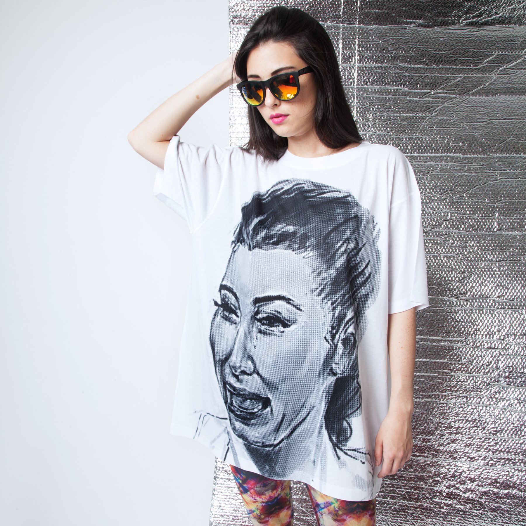 Model in the oversized face tee, sunglasses on