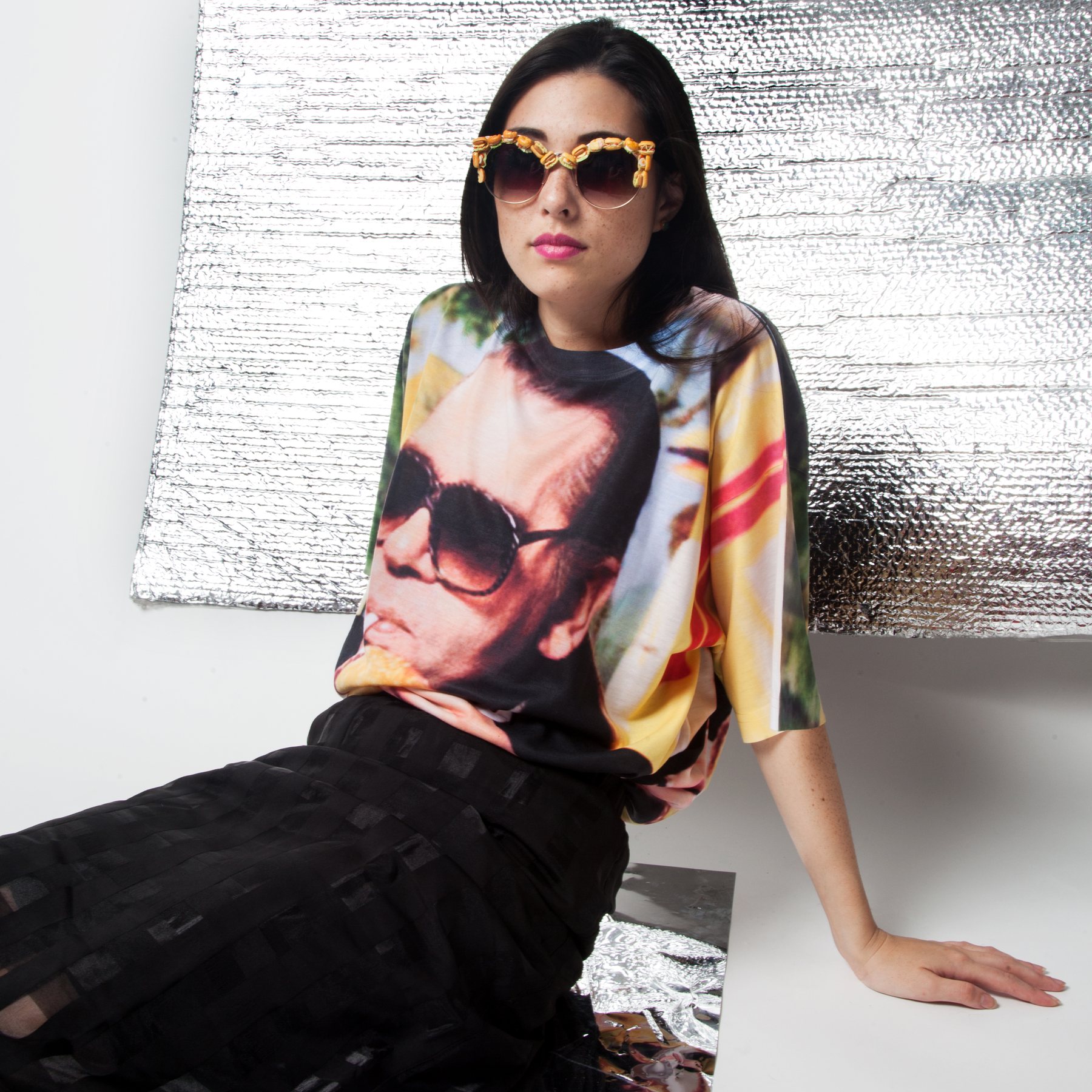 Model reclining in the Lagerfeld tee