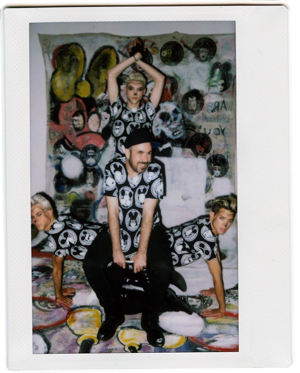 Polaroid of the MadMaus crew on the floor