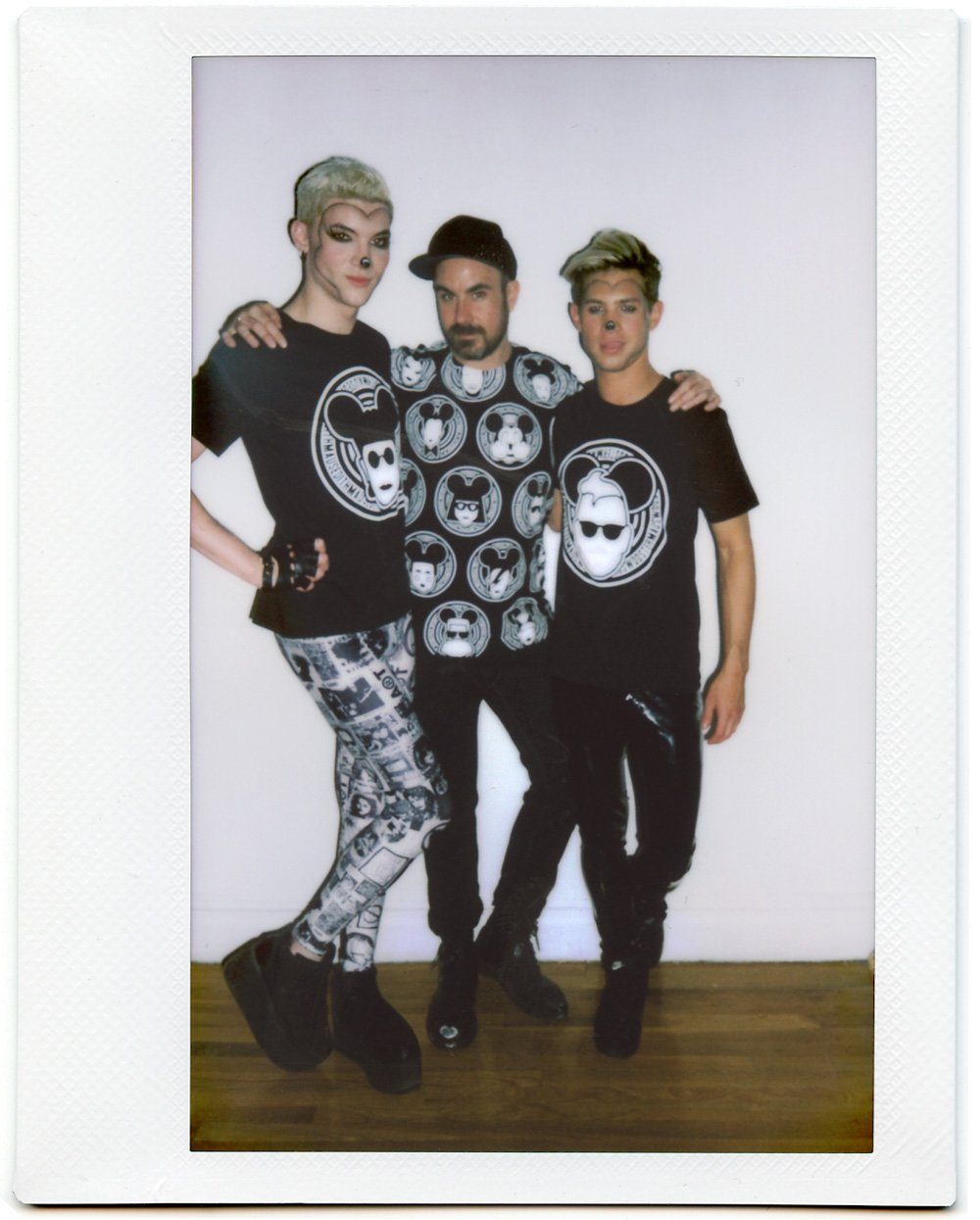 Polaroid of three friends in MadMaus tees