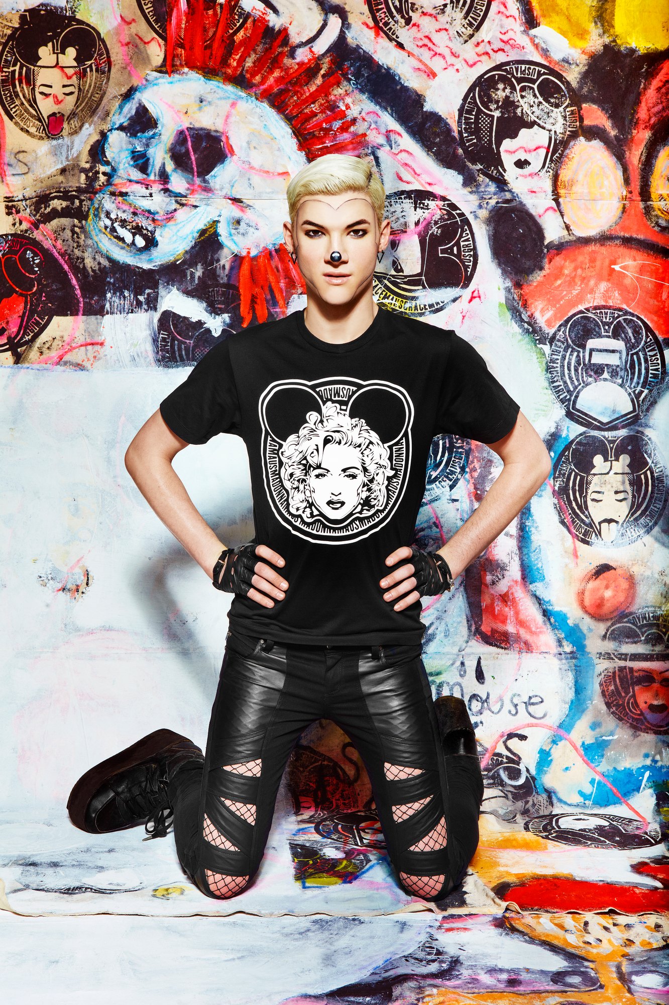 Model kneeling in the MadMaus Madonna seal tee and ripped leather