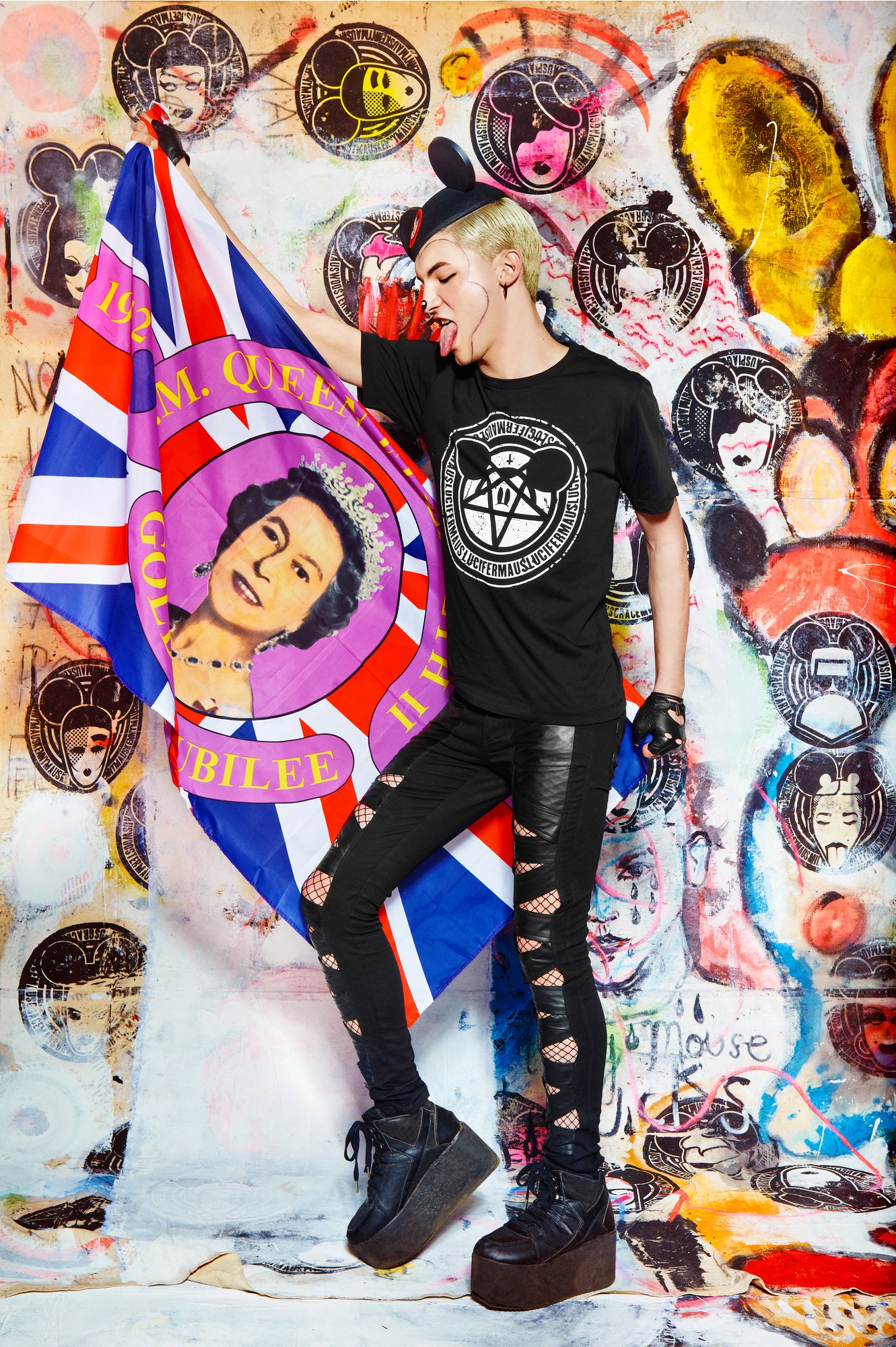 Model holding a Union Jack jubilee flag in a MadMaus seal tee