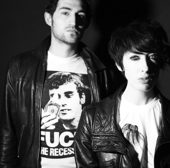 Two friends in Save Anna era tees, black and white