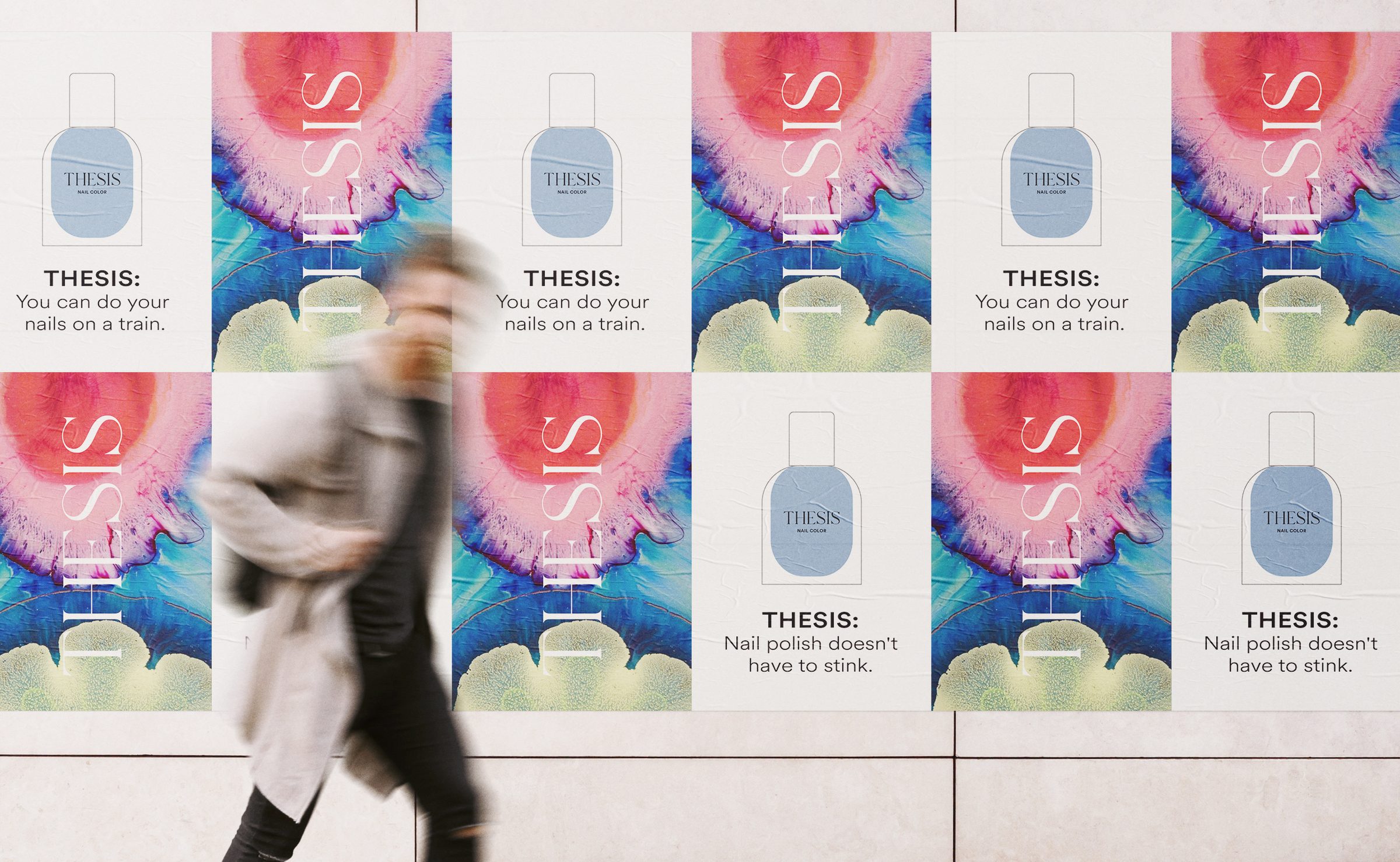 Wild posting mockup: THESIS posters with a blue nail polish bottle and the vertical wordmark on marbled color, a woman walking past